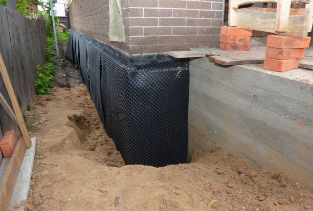 SJ Waterproofing Pros technician performing targeted Interior Drainage System assessment in Sumerduck, VA